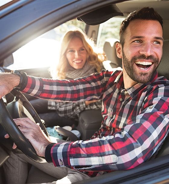 Couple smiling in a car