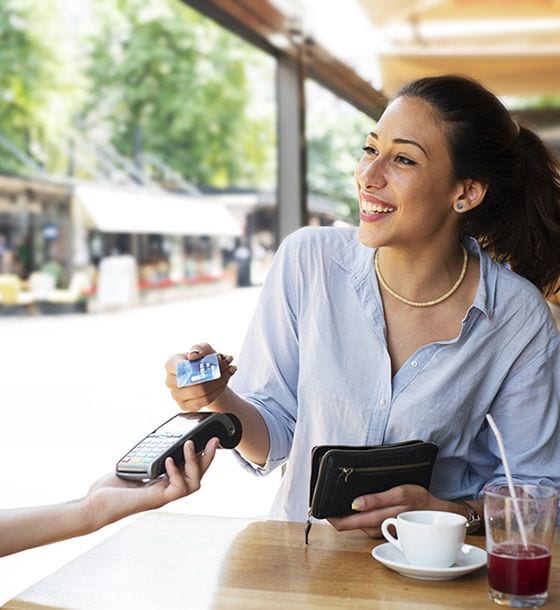 Woman holding debit card