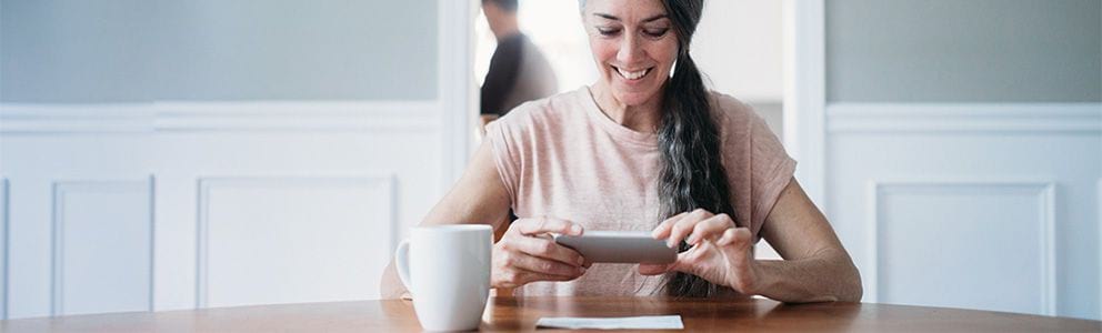 Woman taking a photo of a check