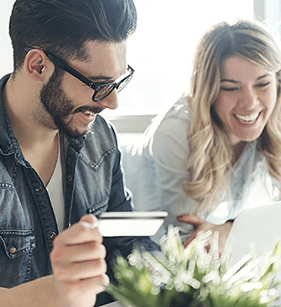 Couple in front of a laptop