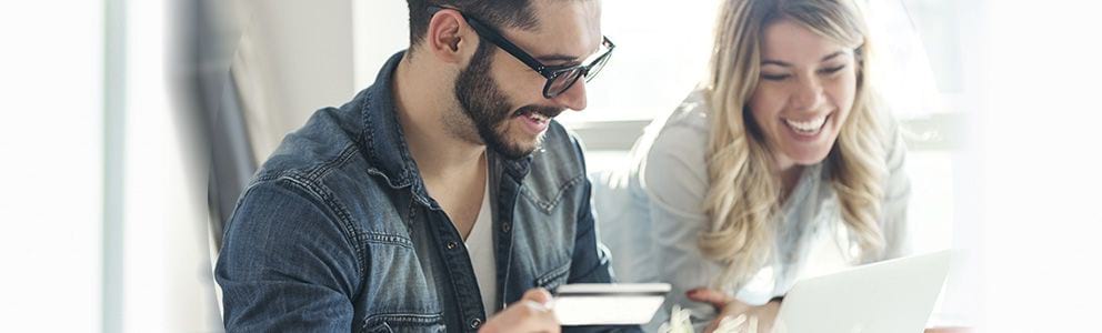 Couple in front of a laptop