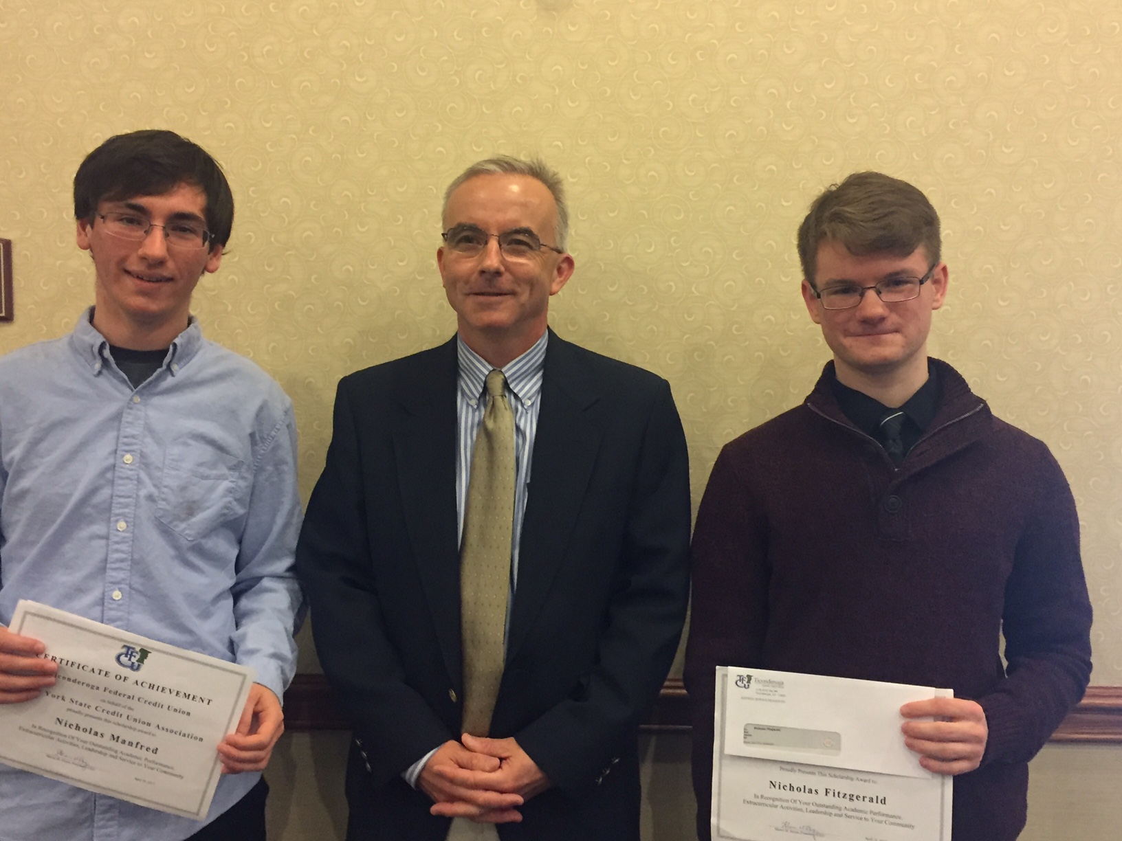 Pictured Here: (left to right) Nicholas Manfred from Moriah Central School; Shawn Hayes, TFCU President & CEO; Nicholas Fitzgerald from TrailNorth High School.