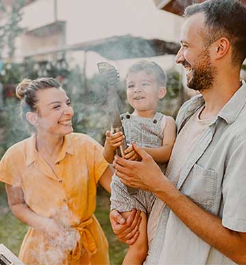 Couple smiling with baby