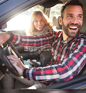 Couple smiling in car